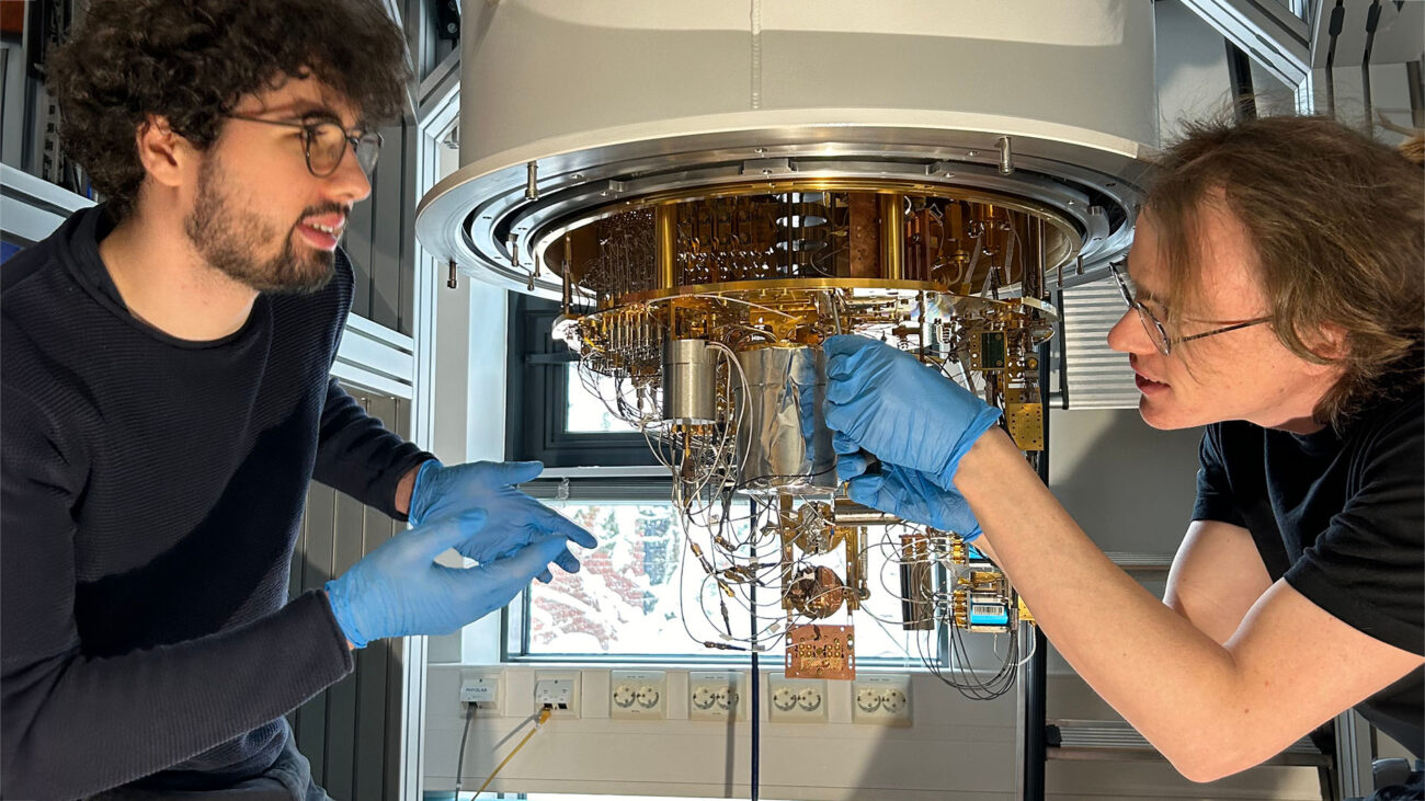 Elias Ankerhold (left) and Dr. Sergei Lemziakov (right) working on a BLuefors XLD Dilution Refrigerator measurement system.